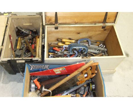 A large collection of woodworking and hand tools, including chisels, spanners, hammers, saws, etc, contained in two wooden to
