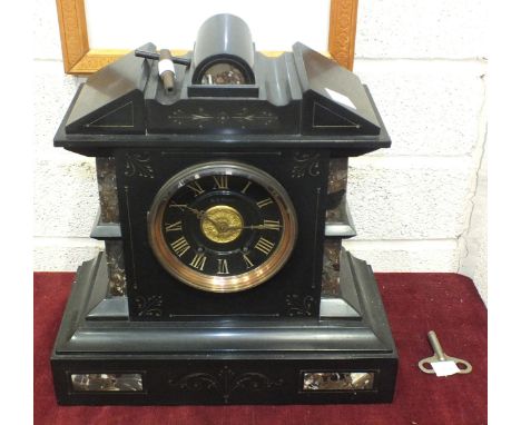 A late-19th century black slate and marble striking mantel clock of architectural form, the black dial with gilt Roman numera