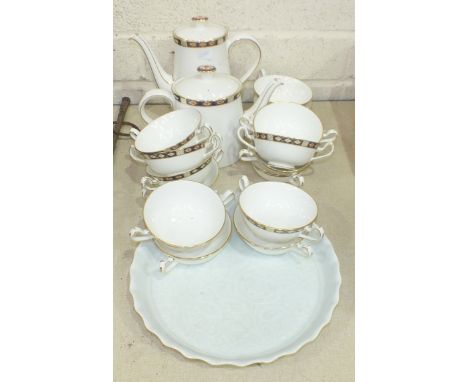 Sixteen pieces of Royal Crown Derby 'Kedleston' teaware and a ceramic cake stand decorated with flowers and foliage. 