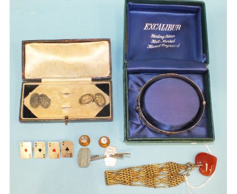 A pair of enamelled silver 'aces' cufflinks, two other pairs of silver cufflinks, a boxed silver hinged bangle, a gold-plated