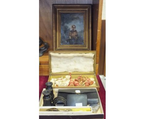 Pieces of an ivory and stained red ivory chess set, (damages), an unsigned oil painting on canvas of a young boy holding a fl