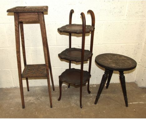 A carved wood three-legged table, a three-tier cake stand and a plant stand, (3). 