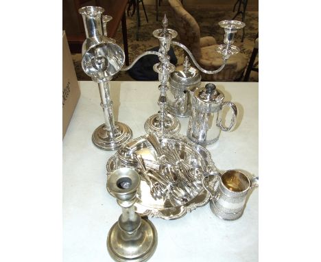 A plated candle lamp with spring-loaded mechanism and reflector funnel, 38cm high, a plated candelabra and other plated items