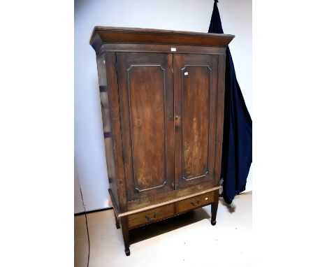  A George III mahogany hall cupboard on stand, two front opening doors to reveal shelf and storage space sitting on two drawe