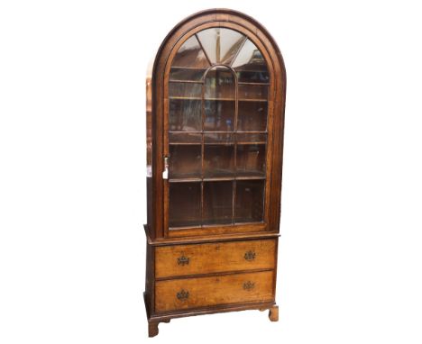 George III oak arched front glazed display cabinet in two parts, base has two single drawers with brass swing handles, standi