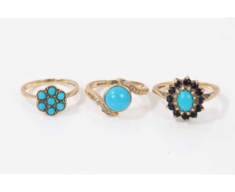 Three 9ct turquoise dress rings including seven stone flower head cluster, size M, cross over ring with diamond set shoulders