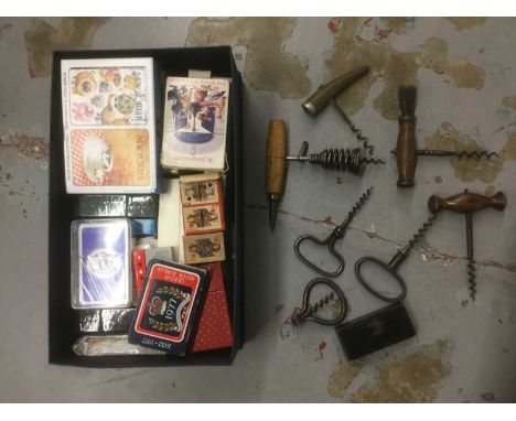 Collection of antique corkscrews, together with a collection of various 20th century playing cards, miniature dominoes in a 1