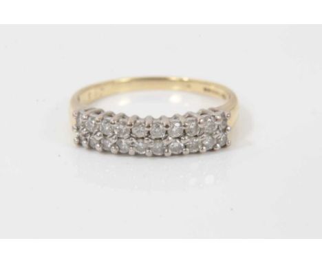 18ct gold diamond double row half eternity ring with twenty brilliant cut diamonds in claw setting. Size RCondition report: W