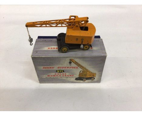 Dinky Supertoys Coles Mobile Crane No. 971 and Muir - Hill Dumper Truck No. 962 and a Heavy Tractor No. 563, all boxed (3)