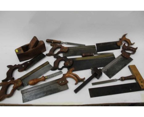 Selection of old hand tools including saws, chisels etc, mostly named