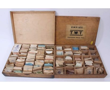 Four wooden boxes of vintage new old stock watch glasses, various sizes and accessories 