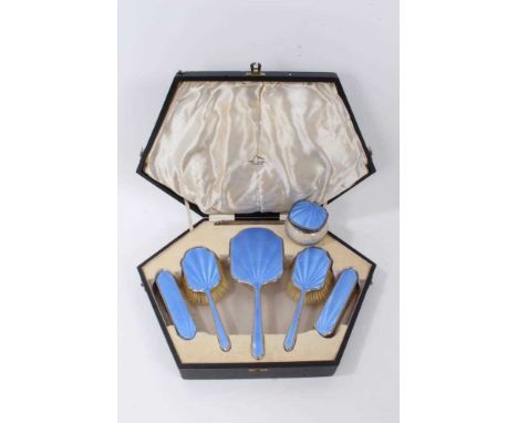 1930s Art Deco five piece silver dressing table set, comprising of a hand mirror and four brushes with blue guilloche enamel 