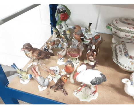 Collection of 23 Goebel porcelain bird ornaments, including a large parrot, and a Goebel mallard dish