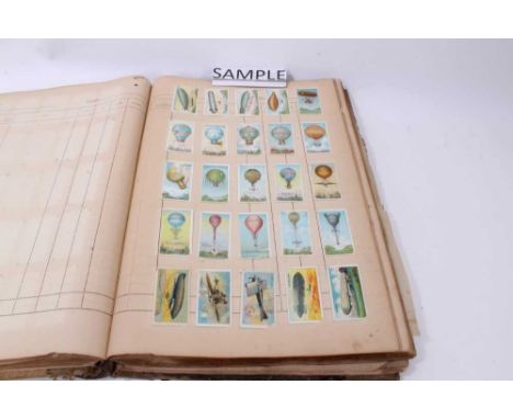 Cigarette Cards - Overseas Issues. Old slip in cut ledger, containing a large selection of early 20th century cards, various 