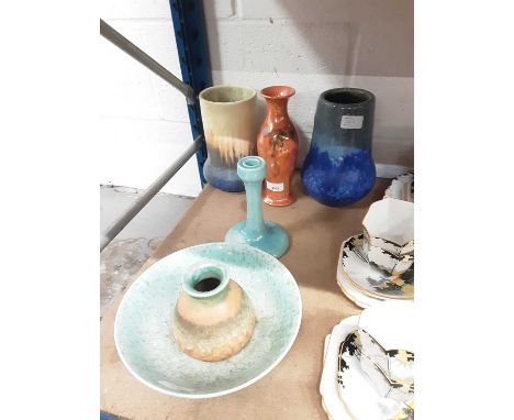 Six items of Ruskin pottery including mottled turquoise bowl, orange lustre vase, candlestick and three vasesCondition report