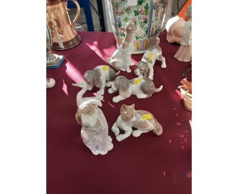 Collection of eight Lladro and NAO animal ornaments, including cats, dogs and geese