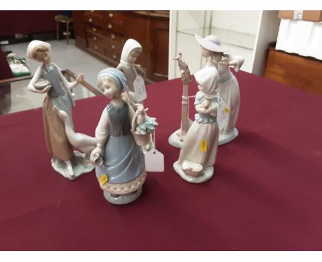 Four Lladro porcelain figures and a Nao figure (5)