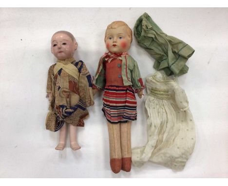 Small early mohair teddy bear with black boot button eyes, a celluloid doll in original clothing and an Oriental boy doll.