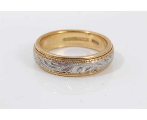 18ct yellow and white gold wedding ring with engraved scroll decoration, size K½Condition report: Weight 6.2 grams