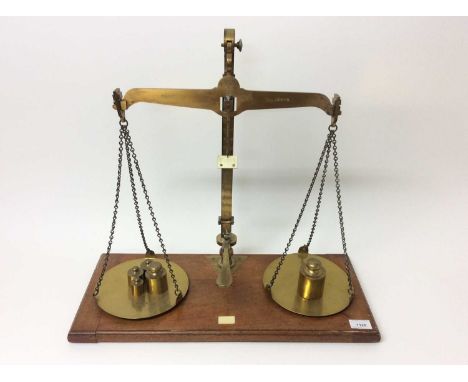 Edwardian lacquered brass weighting scales by De Grave &amp; Co Ltd, marked County of Herts, together with some weightsCondit