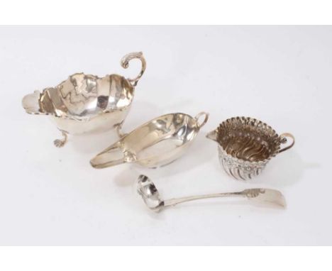 Late Victorian silver sauce boat, Chester 1899, together with another silver sauce boat, Birmingham 1922, a silver cream jug,