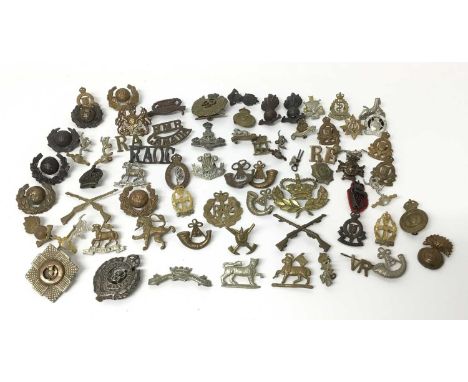 Collection of approximately 60 British Military cap badges including Army Catering Corps, Leicestershire Regiment and RAF (so