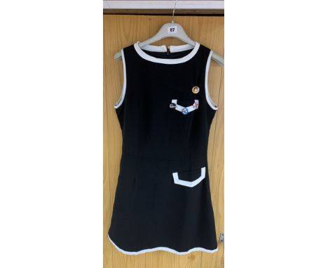 Vintage black and white minidress by Pop, England, size 1. with attached badges for Beatles, Mod, Mod Magic and Jim Morrison