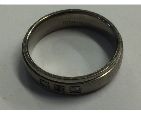 A Gents titanium and diamond ring