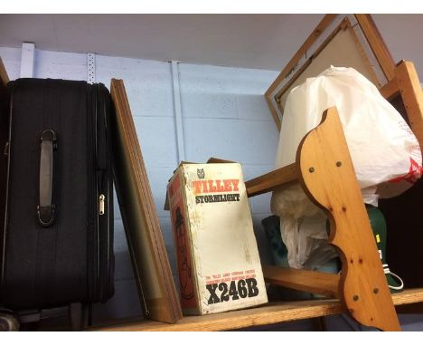 Shelf of assorted including a Tilley lamp