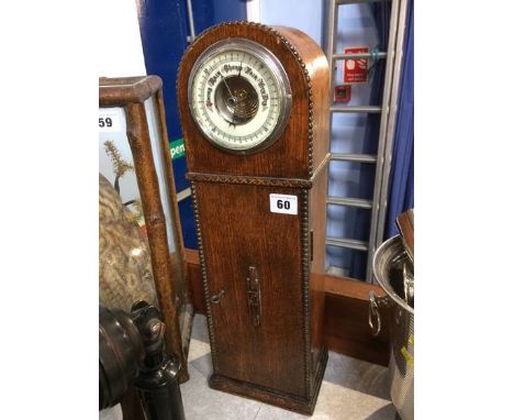 An oak cased barometer