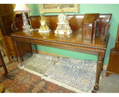 A very elegant and imposing 19th c. Mahogany Buffet Table standing on mirrored twist turned legs terminating in melon shaped 