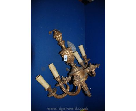 A four-branch wooden Chandelier in poor condition.