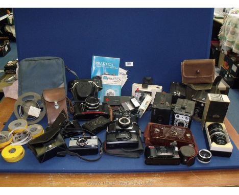 A large quantity of vintage Cameras including a Praktica Super TL 35mm SLR Camera with Carl Zeiss Tessar 50mm f/2.8 Lens, Oly