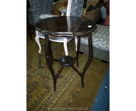 An Edwardian dark wood circular Occasional Table having legs united by a lower shelf, 22'' diameter x 29'' high