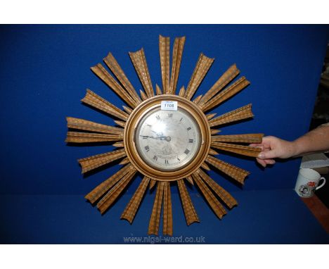 A wooden framed Sunray battery operated Wall Clock with face, Roman numerals and ship design, 20 1/2'' diameter overall