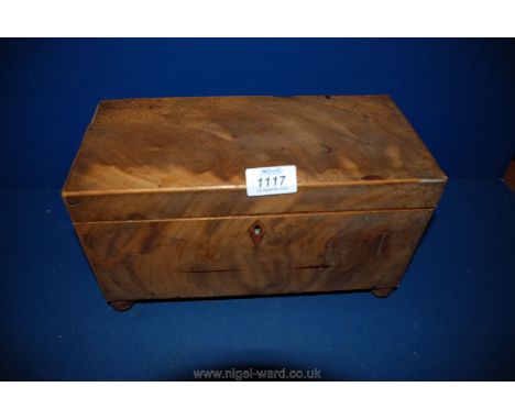 A veneered Tea Caddy standing on bun feet, with marquetry detail to the interior of the lid, small hole to right hand lower c