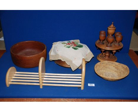A large treen Bowl, 9 1/2'' diameter, a bun-footed circular topped footstool with tapestry top (not completed), a book slide 