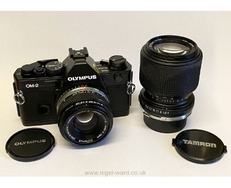 An Olympus OM-2 Spot/Program 35mm SLR Camera with Olympus Zuiko Auto-S 50mm f/1.8 lens, an Olympus fitting Tamron 70-210mm f/