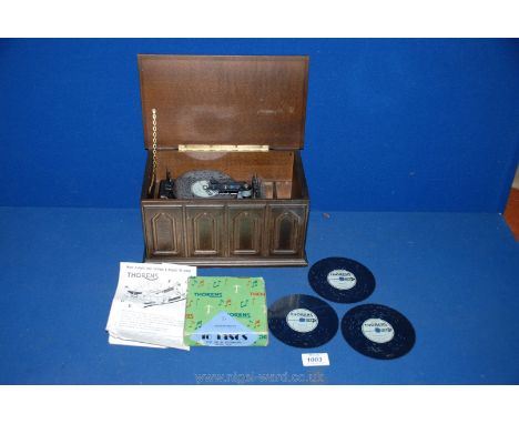 A 1980's reproduction Polyphon, 11'' x 6 1/2'', with discs.