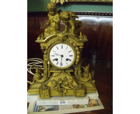 An elegant Ormolu/gilded Mantel Clock having a movement striking on a bell by Japy Freres &amp; C., numbered 2725/64 with whi