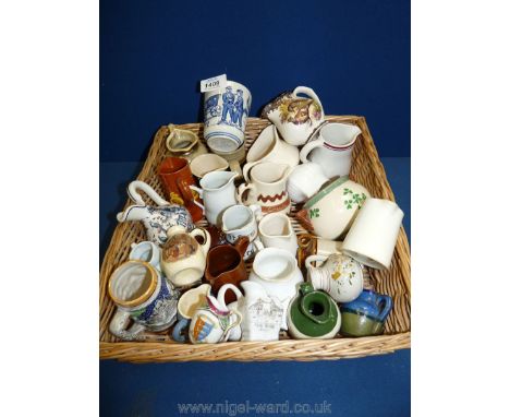 A wicker tray of small jugs, Crested ware, Royal Worcester Palissy, Blue and white Delft beaker, etc.,