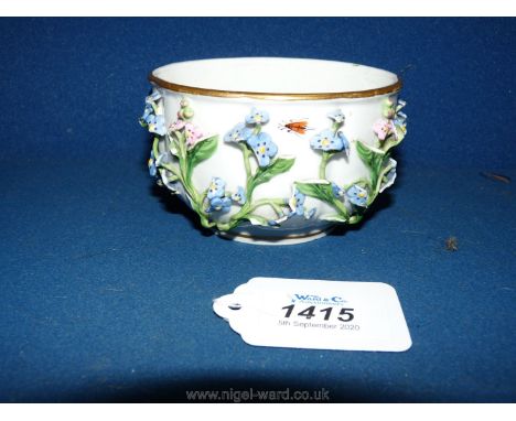 A Meissen sugar bowl circa 1750 or possibly later, with raised floral decoration in early style, heavily potted with shallow 