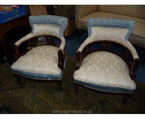 A pair of very appealing Edwardian bow back/tub Armchairs having turned front legs, fretworked back supports and professional