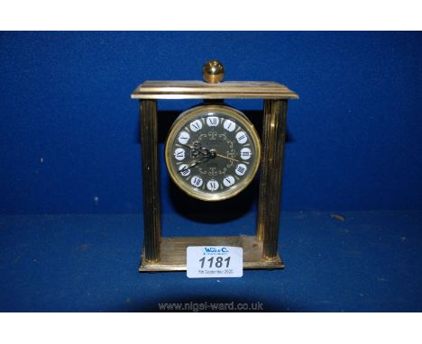 A Looping 15 jewel eight day Brass alarm Clock with four pillars, 5'' tall. 