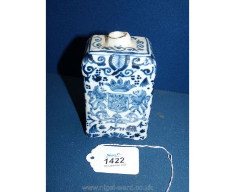 A 19th c. Dutch Delft tea caddy decorated with the arms of The House of Orange and a bird among flowers. Makers mark to base.