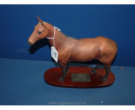 A Beswick Connoisseur series model of Arkle, 11 1/4'' long x 12'' tall.