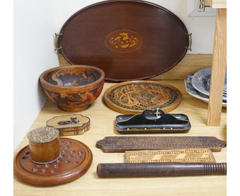 A group of wood items to include two cribbage boards, a mahogany solitaire board with marbles, a truncheon and an inlaid oval