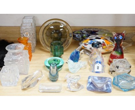 A collection of clear and coloured art glassware, including an Art Deco scent bottle and stopper and a pot and cover, largest