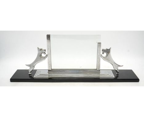 An Art Deco chrome and glass photograph frame on stand, surmounted with two Highland terriers, 48cm wide. Condition - fair