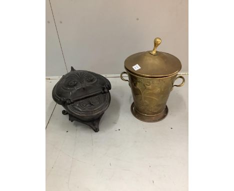 A Victorian cast iron coal scuttle, width 34cm, height 29cm, together with an Art Nouveau style embossed brass coal bin. Cond